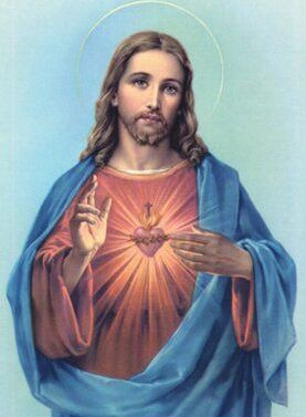 Jesus with Sacred Heart, right hand raised in blessing, blue robe, glowing heart on chest.