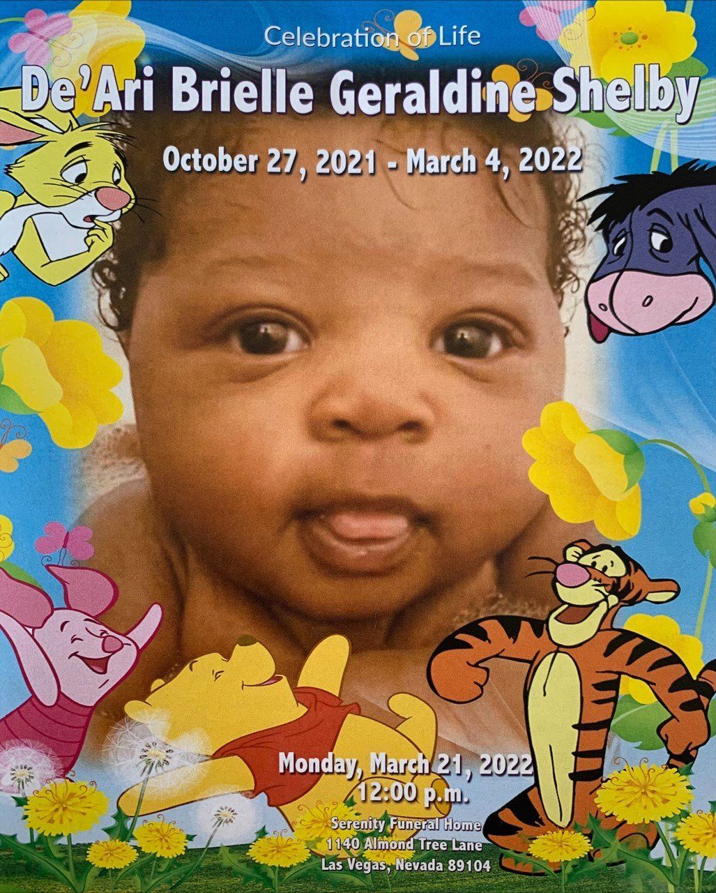 Memorial poster with baby portrait, colorful cartoon characters, and dates October 27, 2021–March 4, 2022