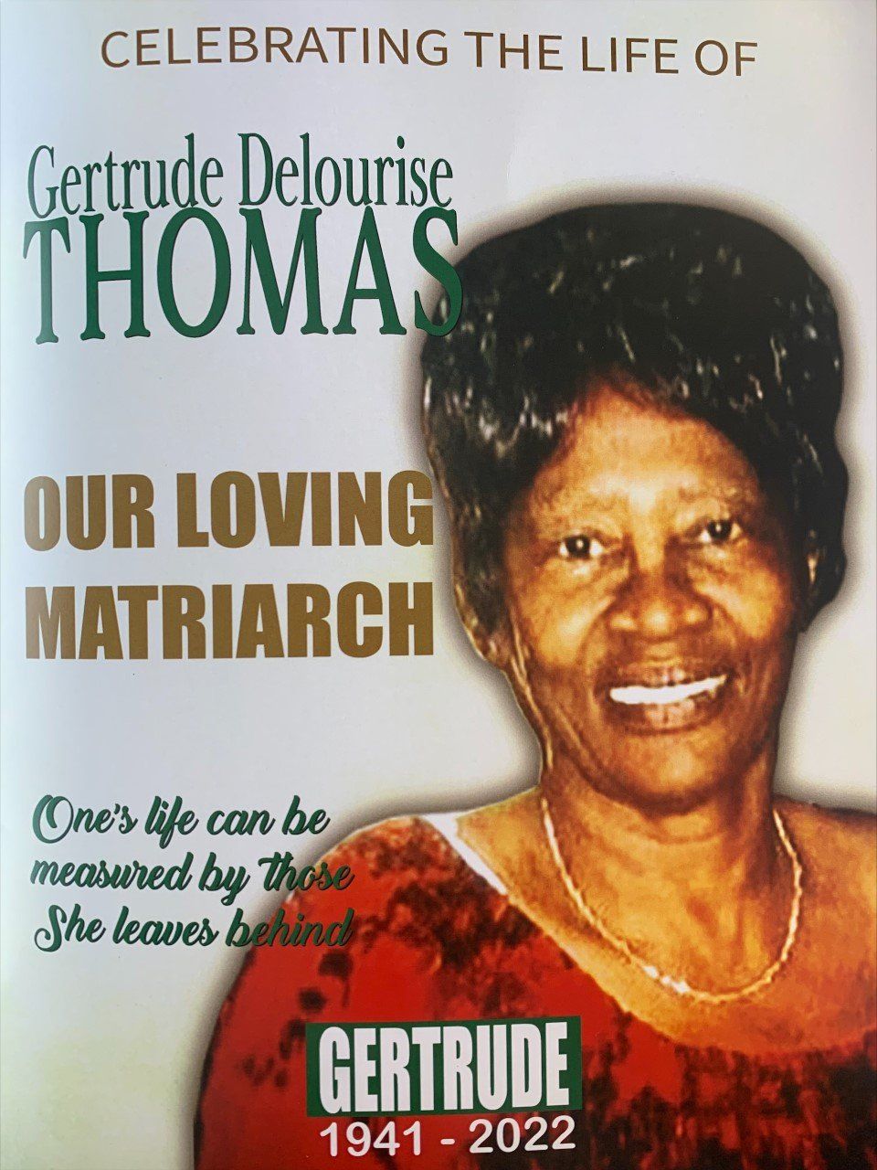 Memorial poster for Gertrude DeLouris Thomas with portrait, dates 1941–2022, and “Our Loving Matriarch” text