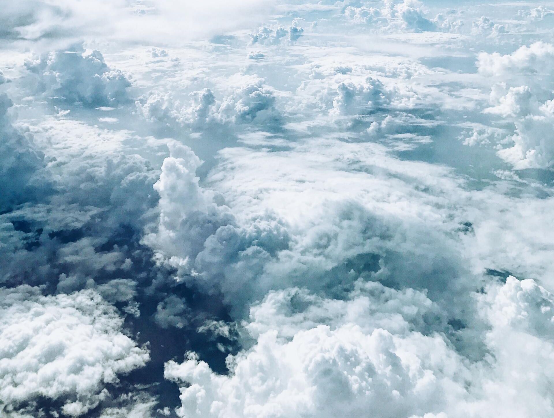 Aerial view of white clouds floating over a blue sky