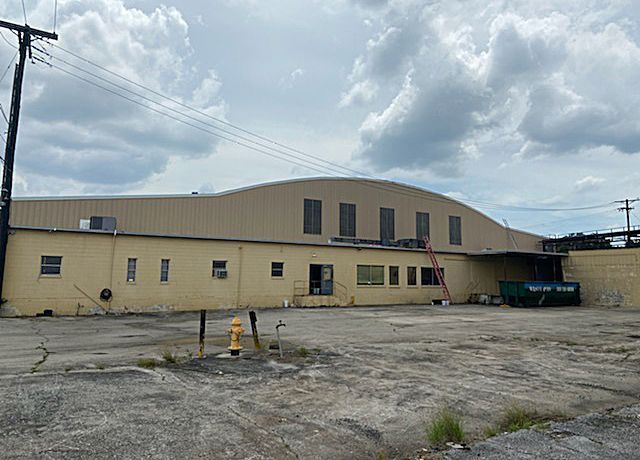 A large building with a fire hydrant in front of it.