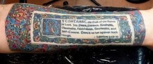 Colorful tattoo sleeve with a rectangular text panel on a forearm