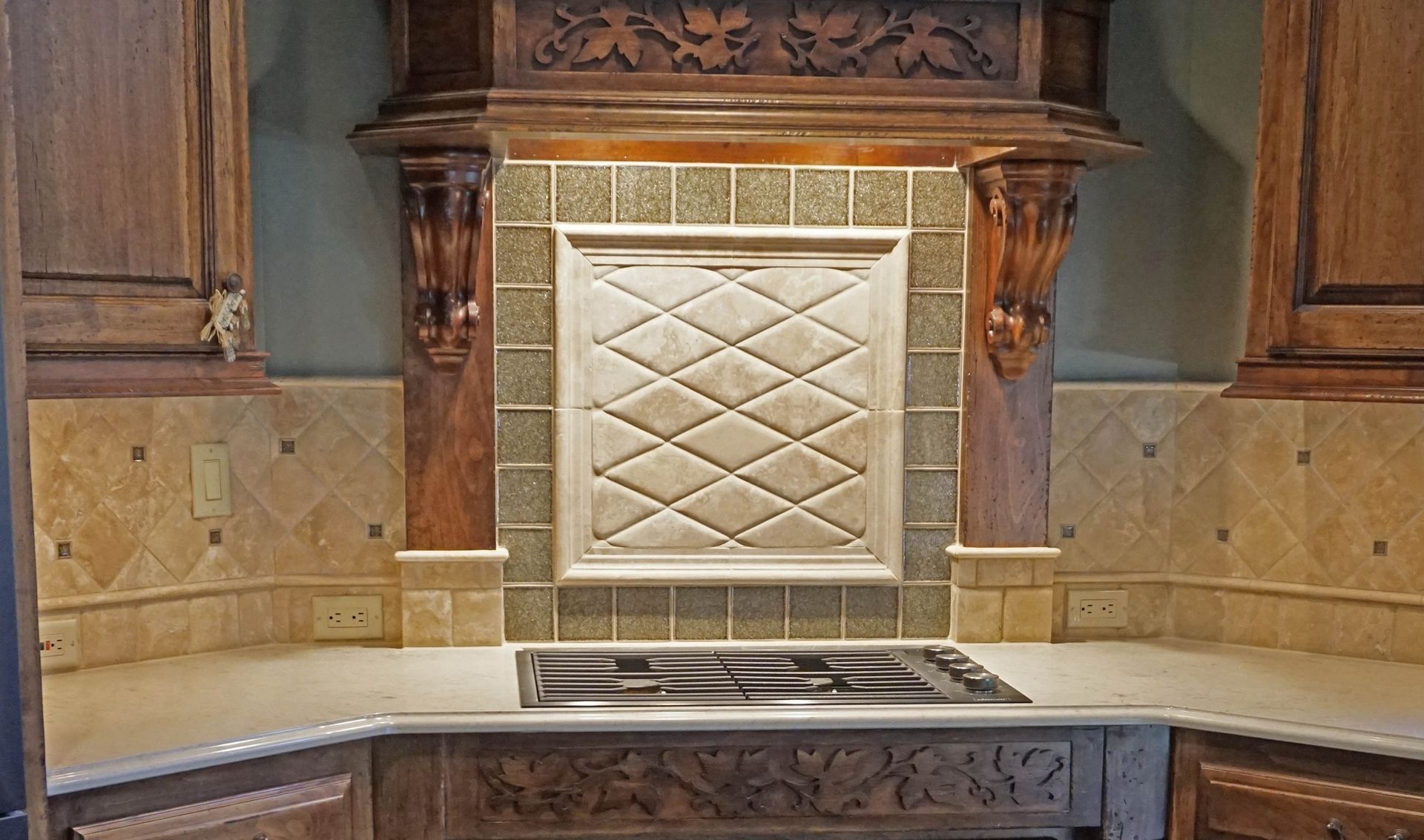 A kitchen with a stove top oven and a wooden hood