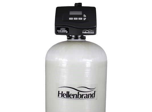 A white Hellenbrand water softener tank with a black digital control valve on top.