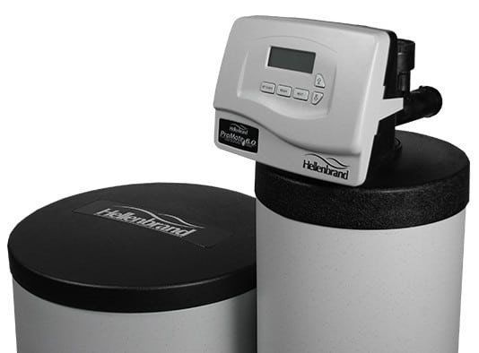 A Hollenbrand water softener system featuring a tall, light gray tank with a digital control head and a separate brine tank.