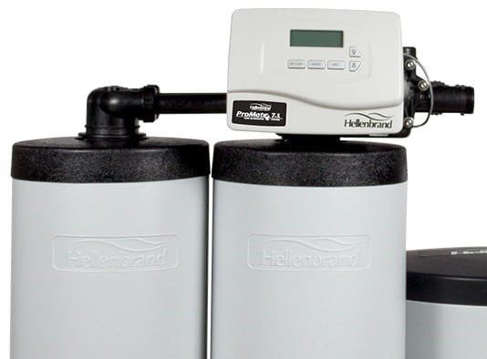 A Hellenbrand water softener system featuring a digital control valve atop a light grey cylindrical tank.