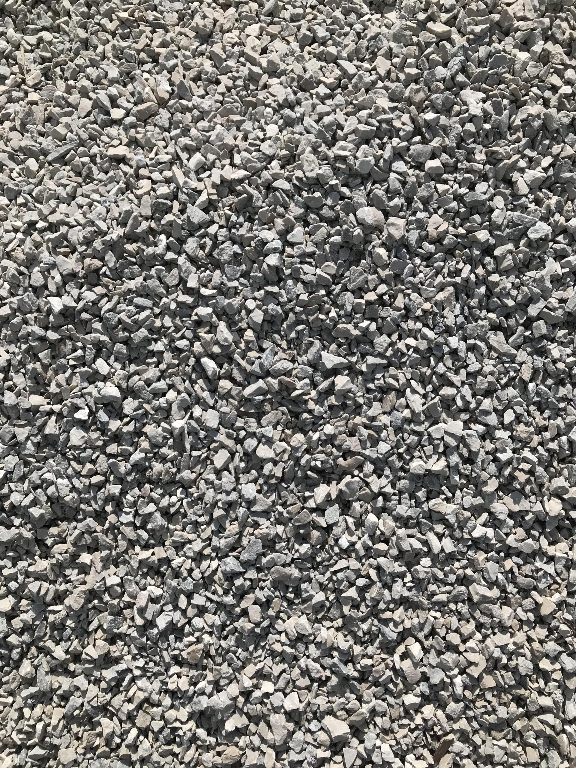 A pile of gravel is sitting on the ground.