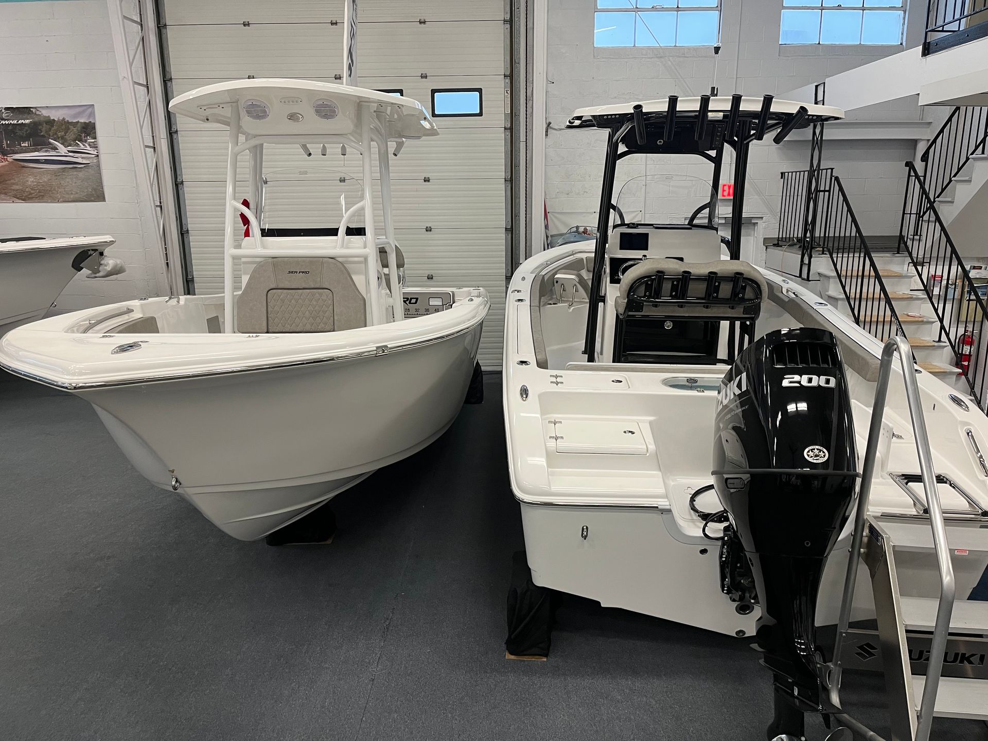 Two white boats in the showroom