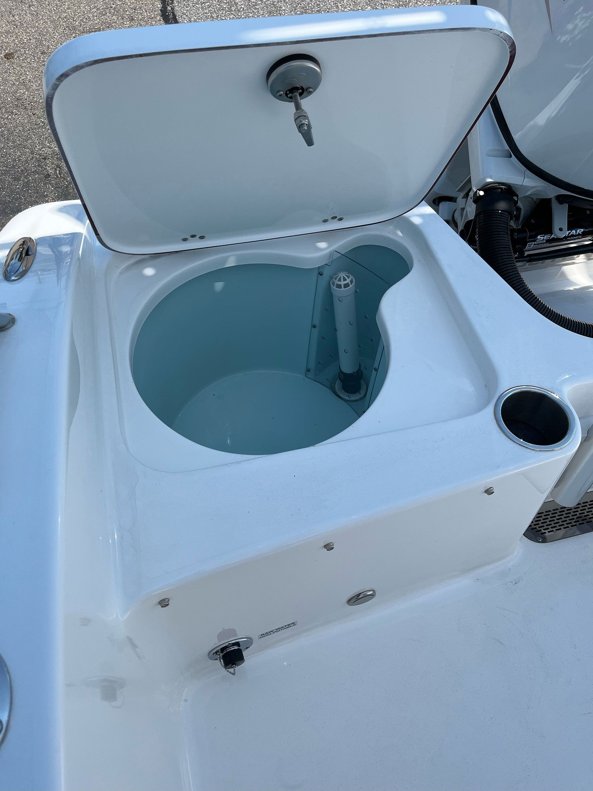 A white boat with an open compartment