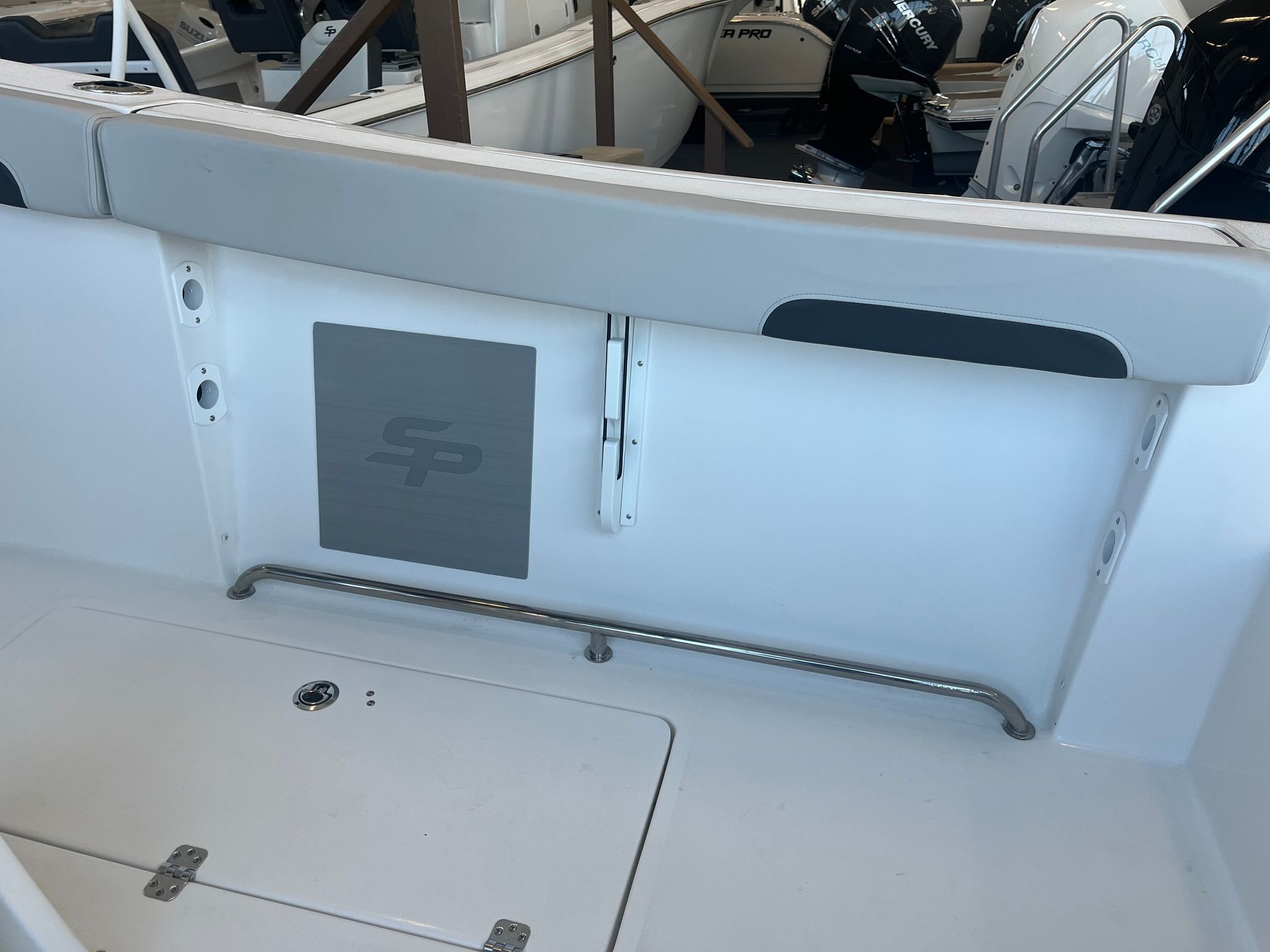 The back of a white boat with the letter s on it