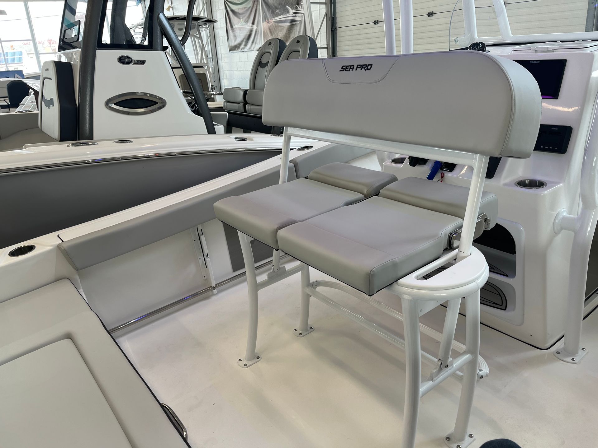 There is a bench on the back of a boat.