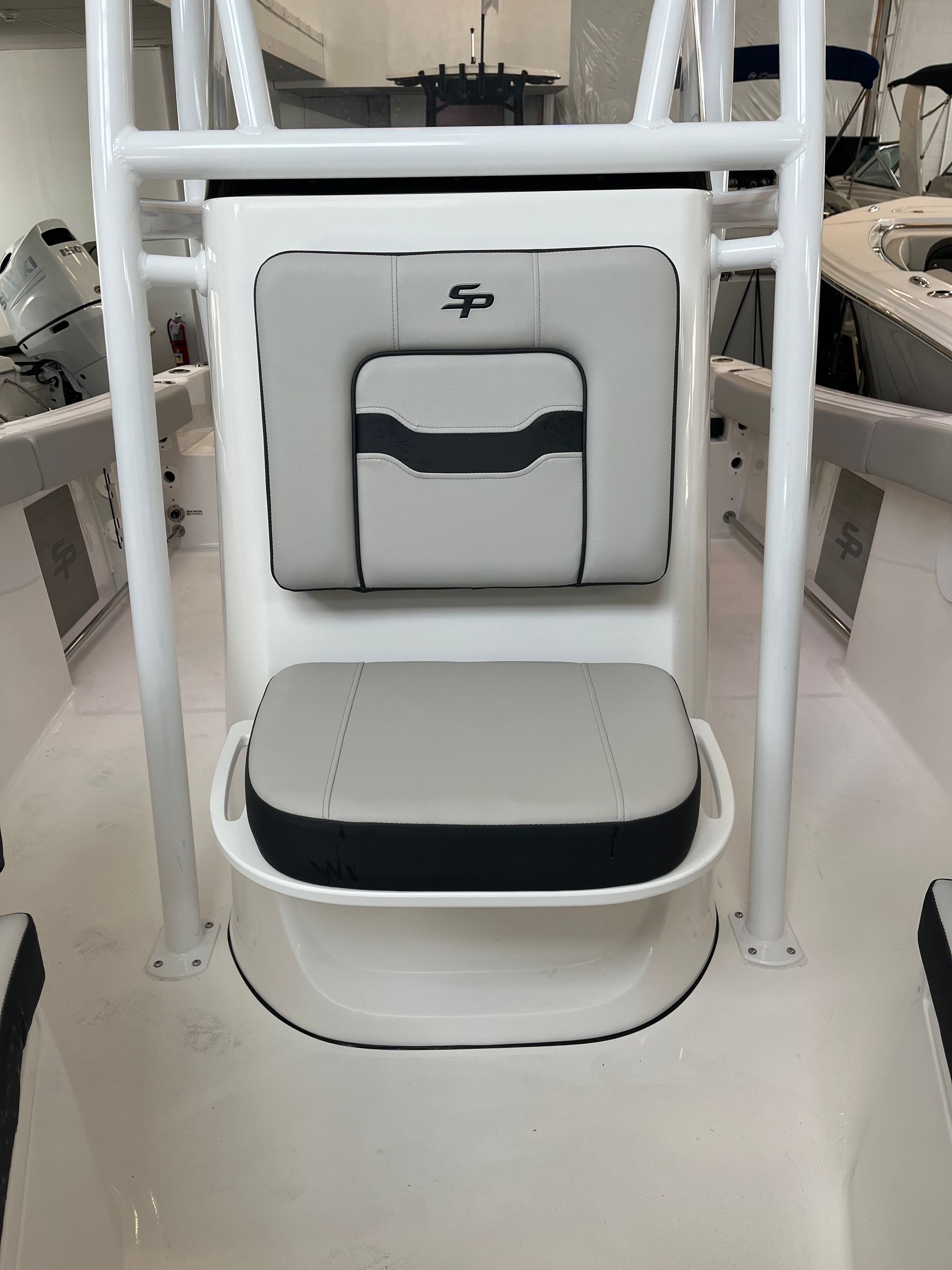 A boat with a seat on the back of it.