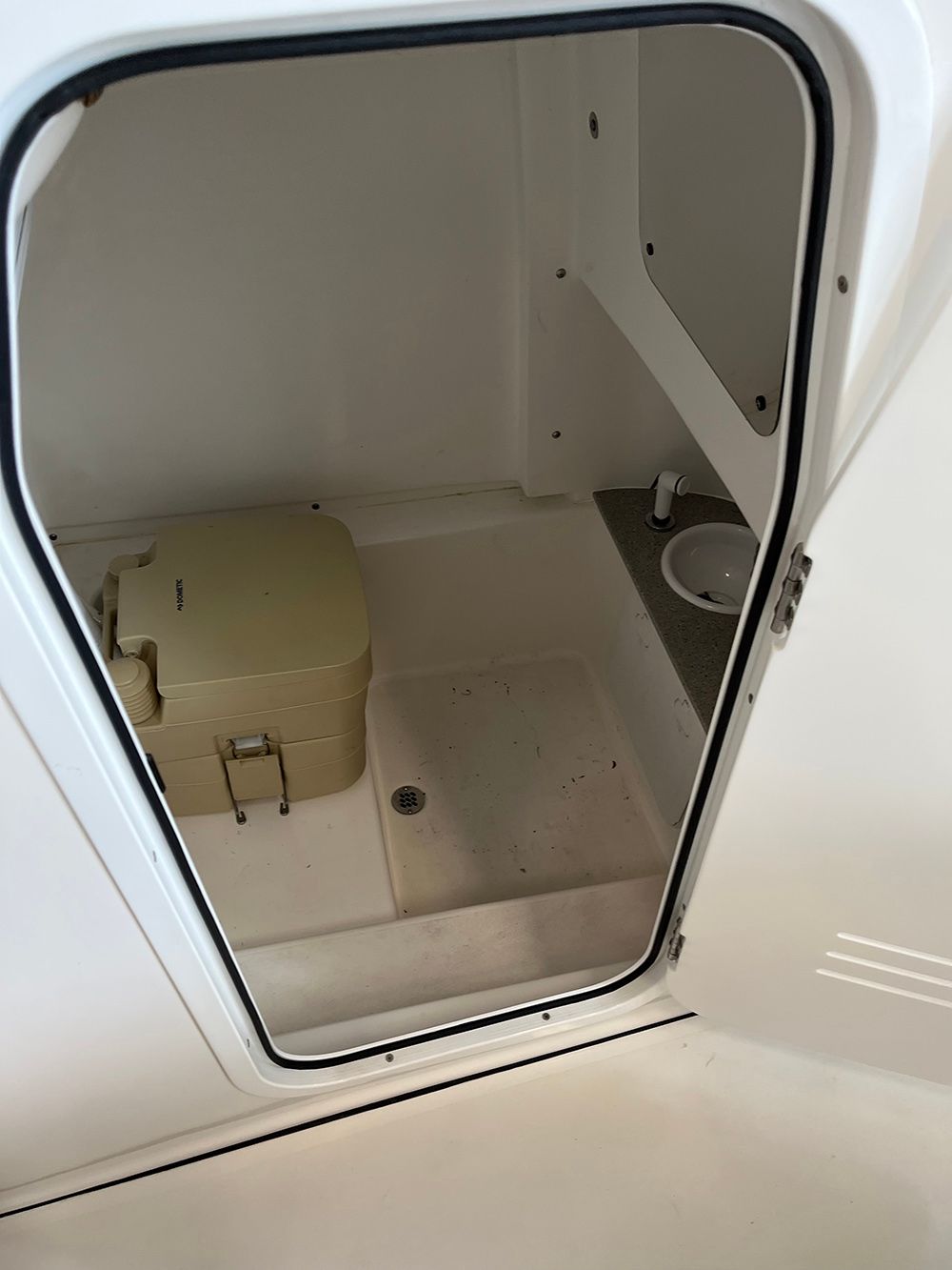 A bathroom with a toilet and a sink in it