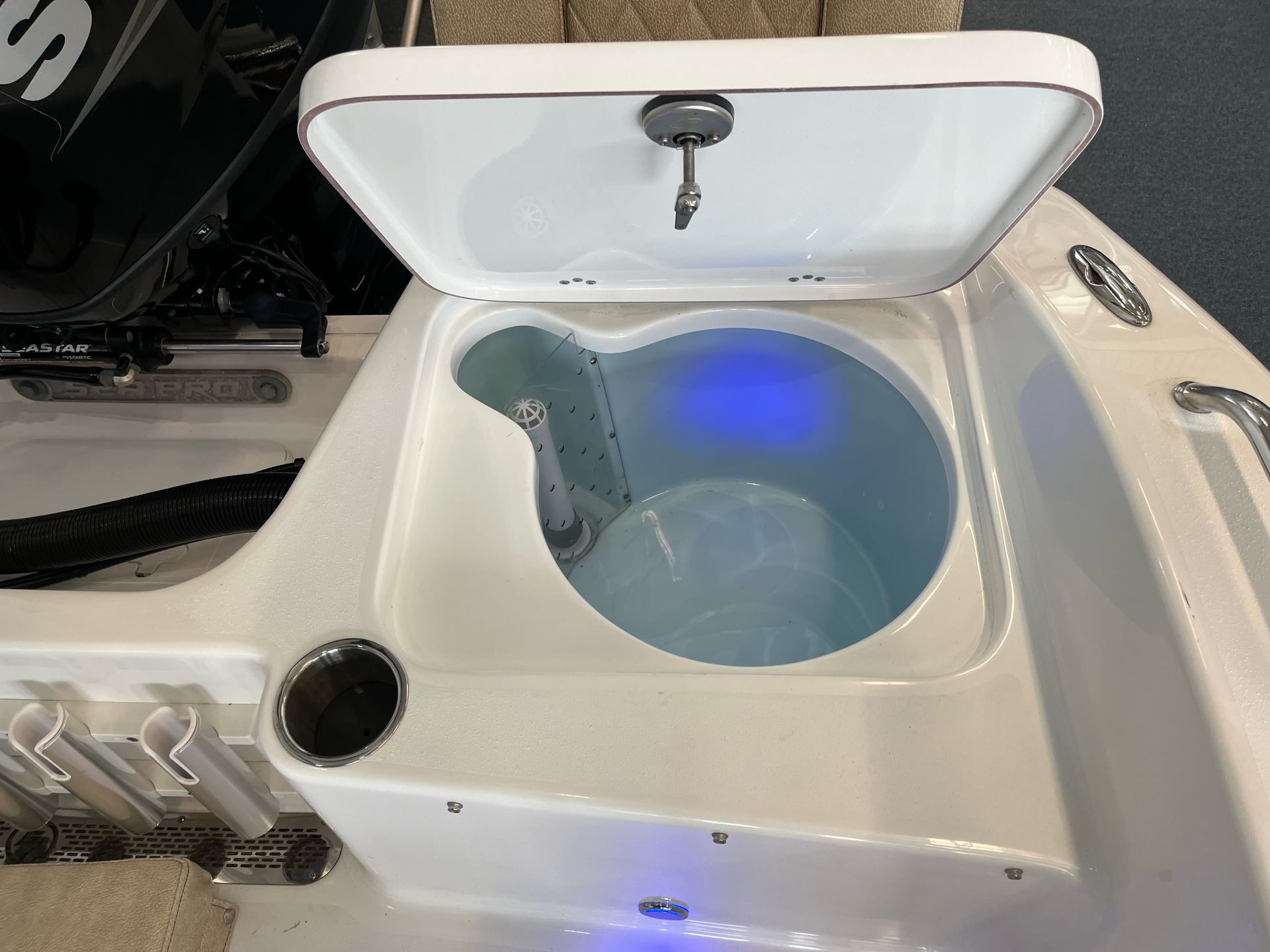 A boat with the lid open and a blue light on it