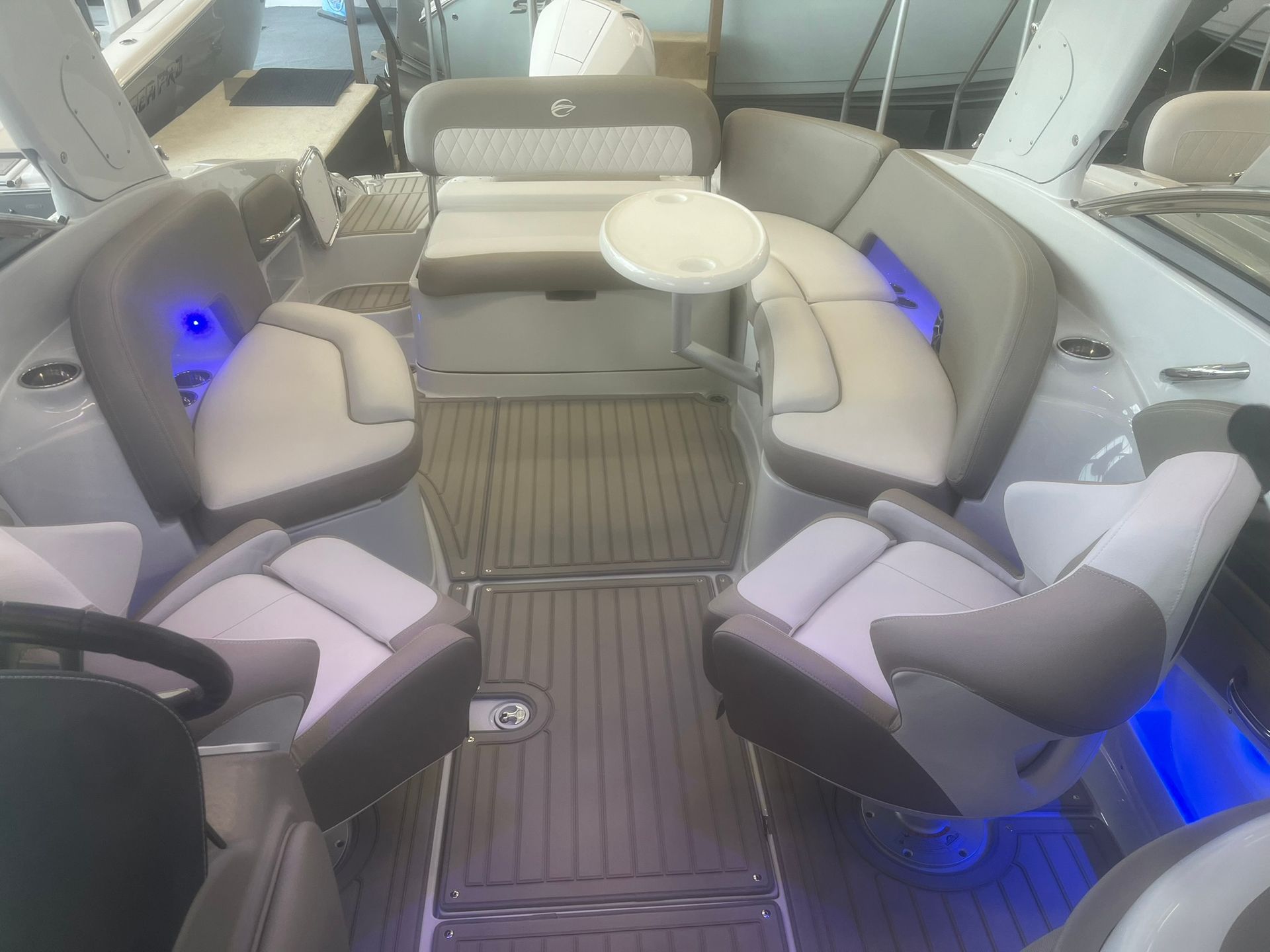 The inside of a boat with a table and chairs