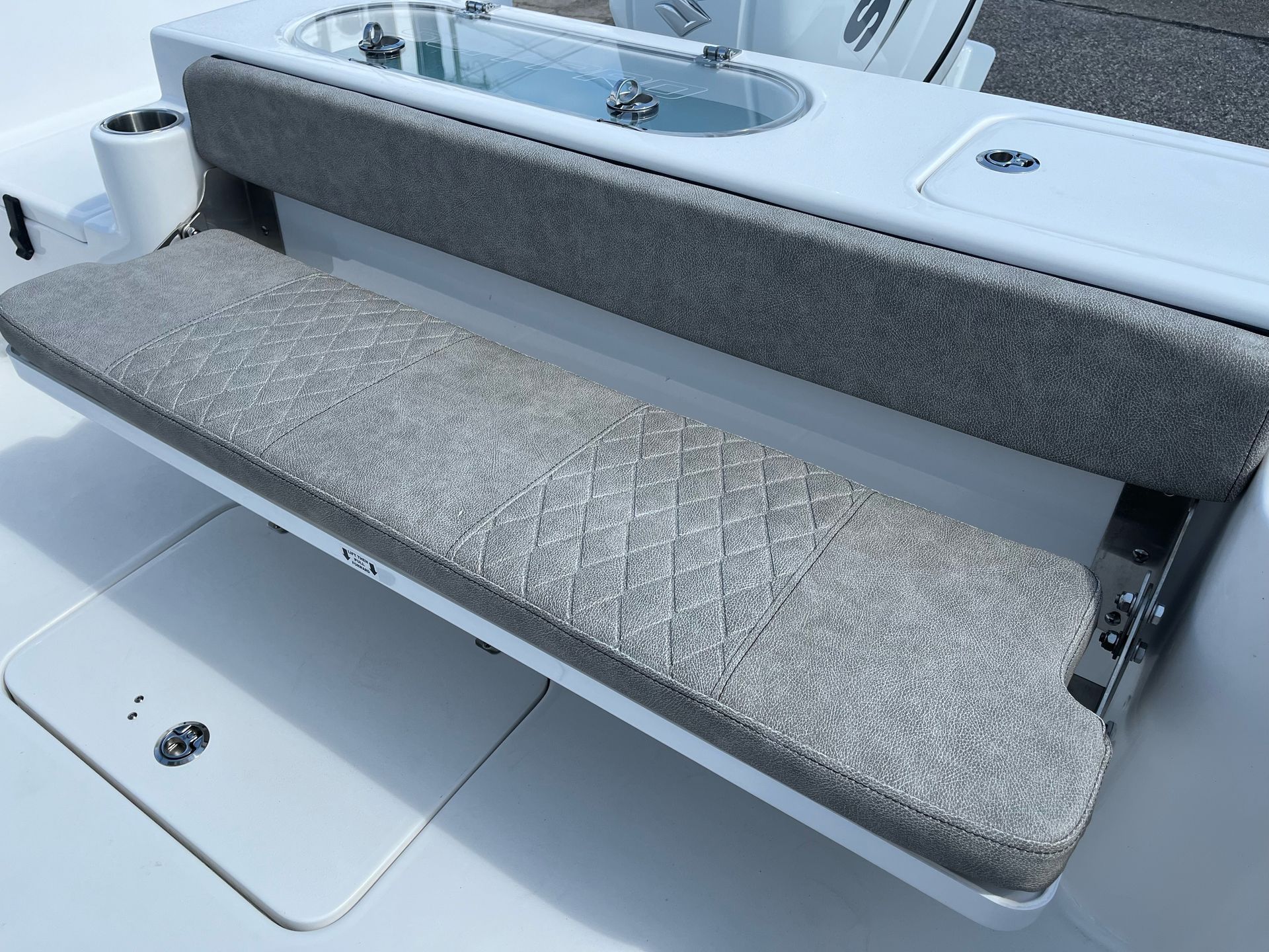 A boat with a gray seat