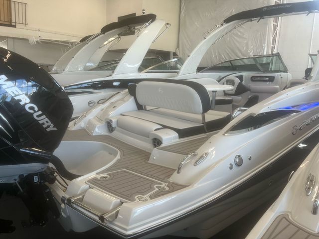A white boat with a black mercury outboard motor