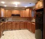A kitchen with wooden cabinets and stainless steel appliances.