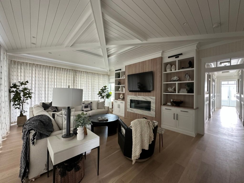 A living room filled with furniture and a flat screen tv