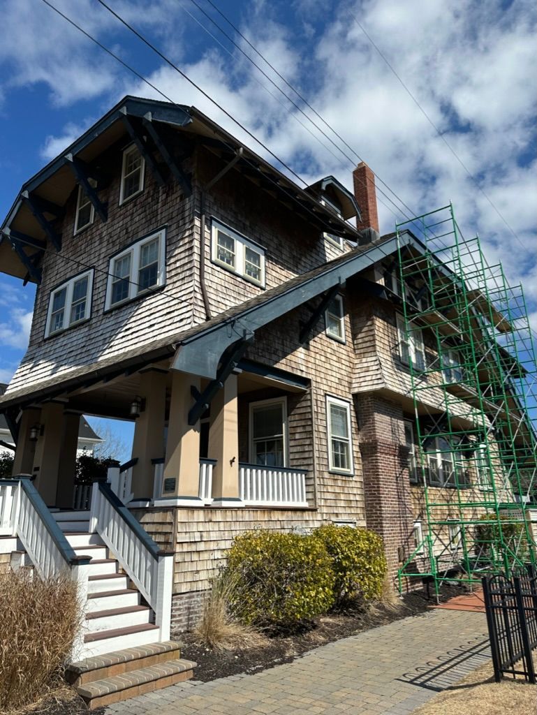 A large house with stairs and scaffolding around it