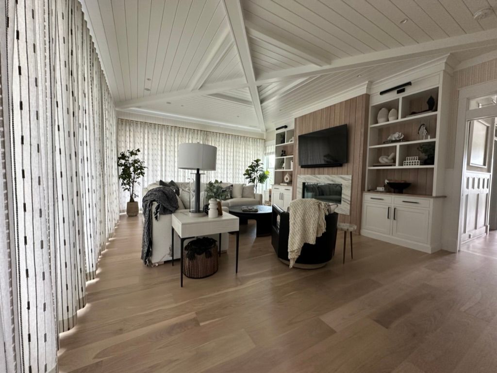 A living room filled with furniture and a fireplace.