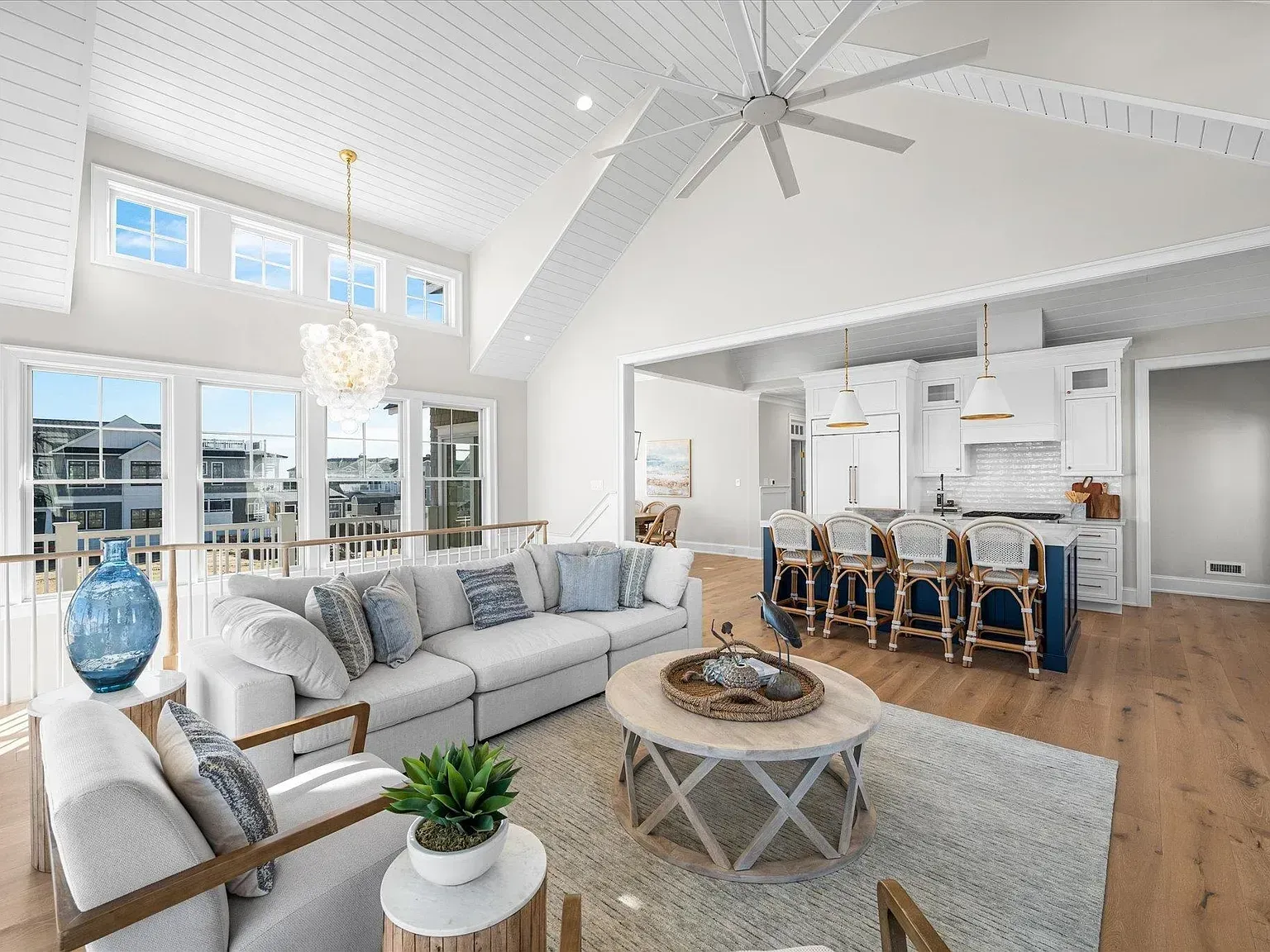A living room filled with furniture and a ceiling fan.
