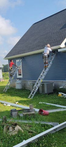 Two men on ladders