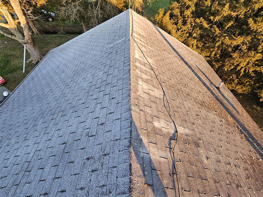 A picture of a roof before being cleaned