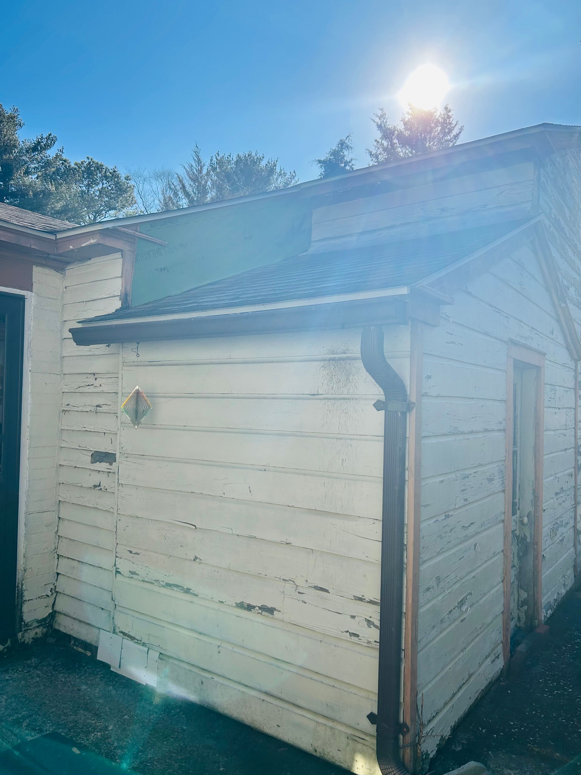 A white house with a blue sky in the background