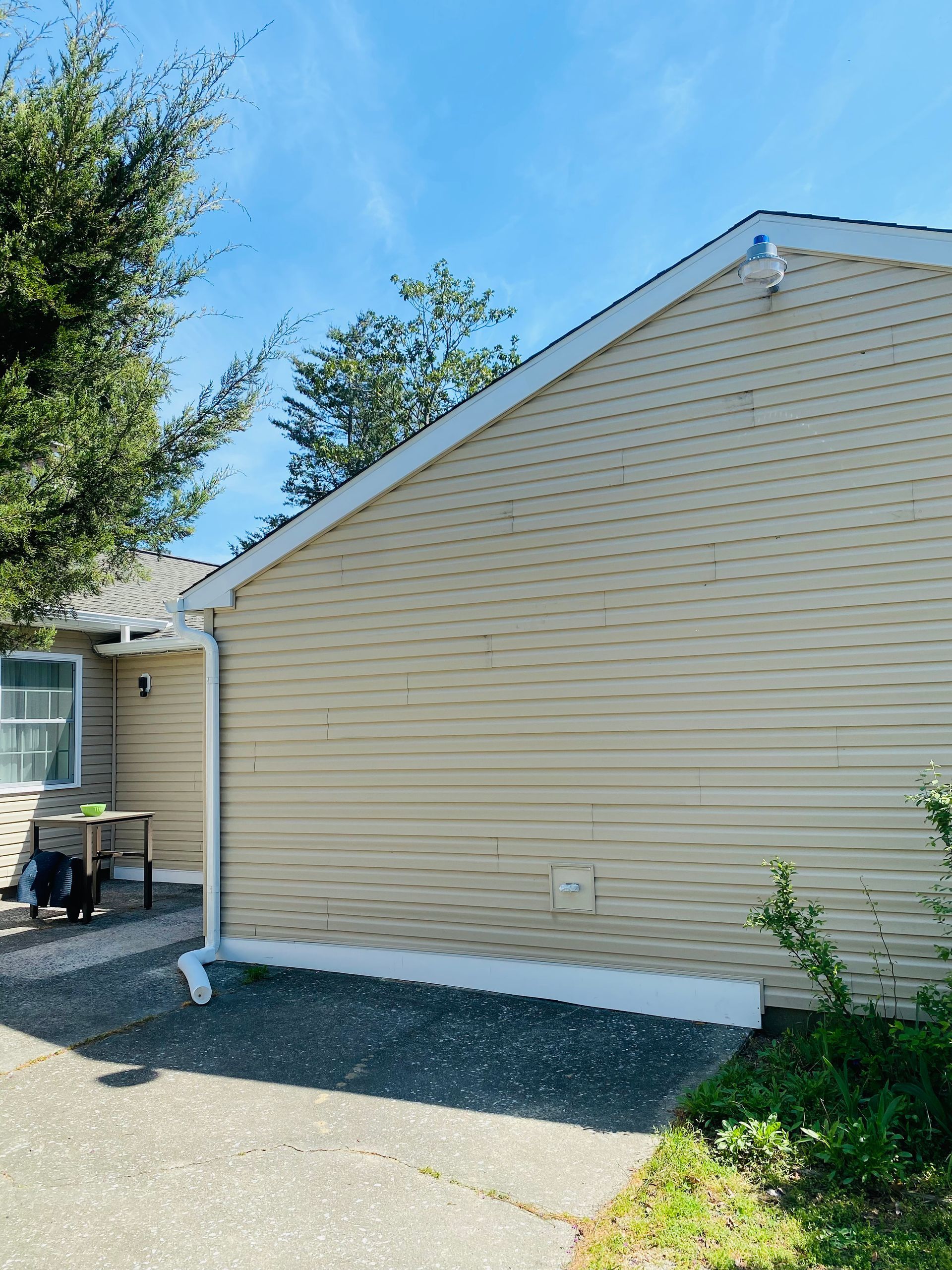 A house with a roof that has a gutter on it