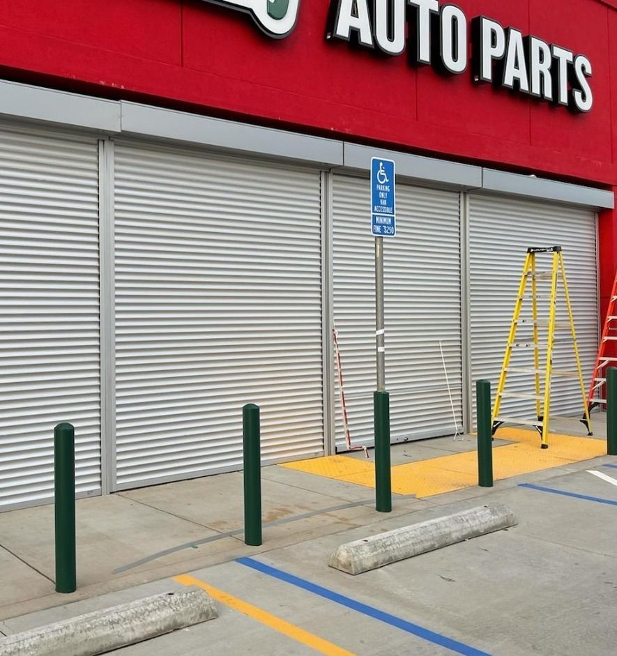 An auto parts store with a ladder in front of it