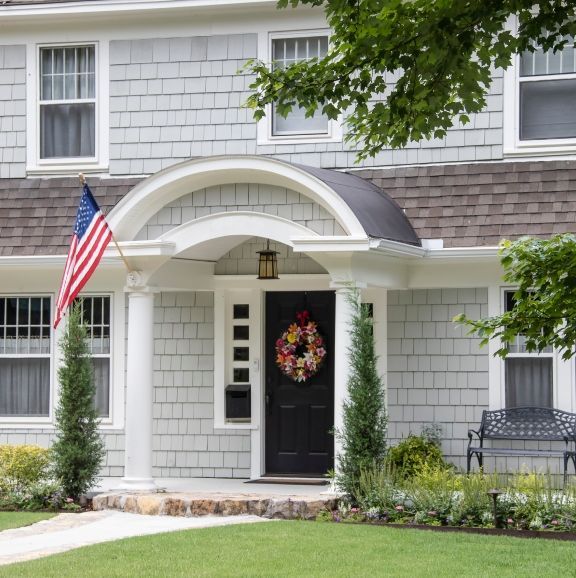The front of a house with a wreath on the door