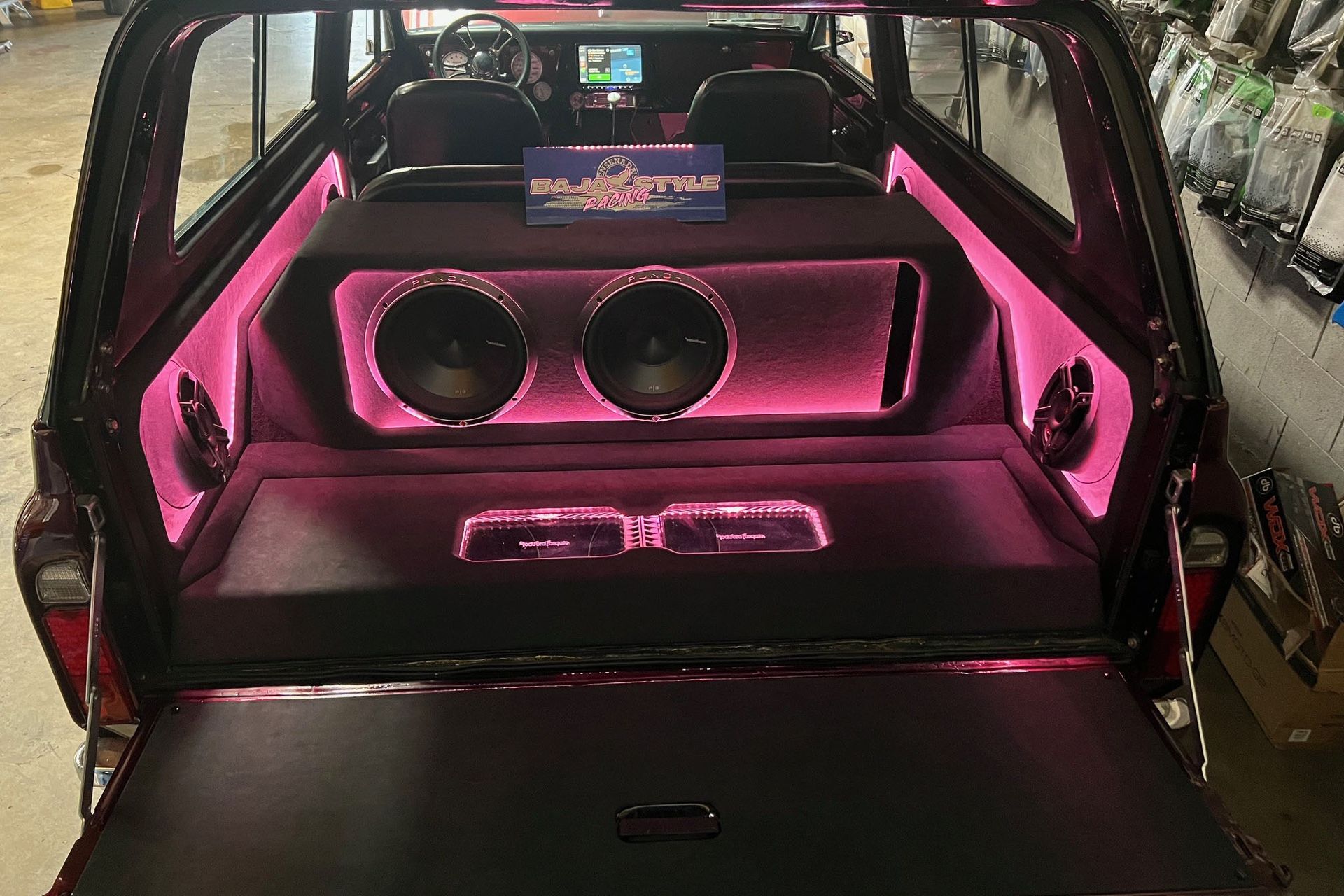 The back of a car with a subwoofer in it