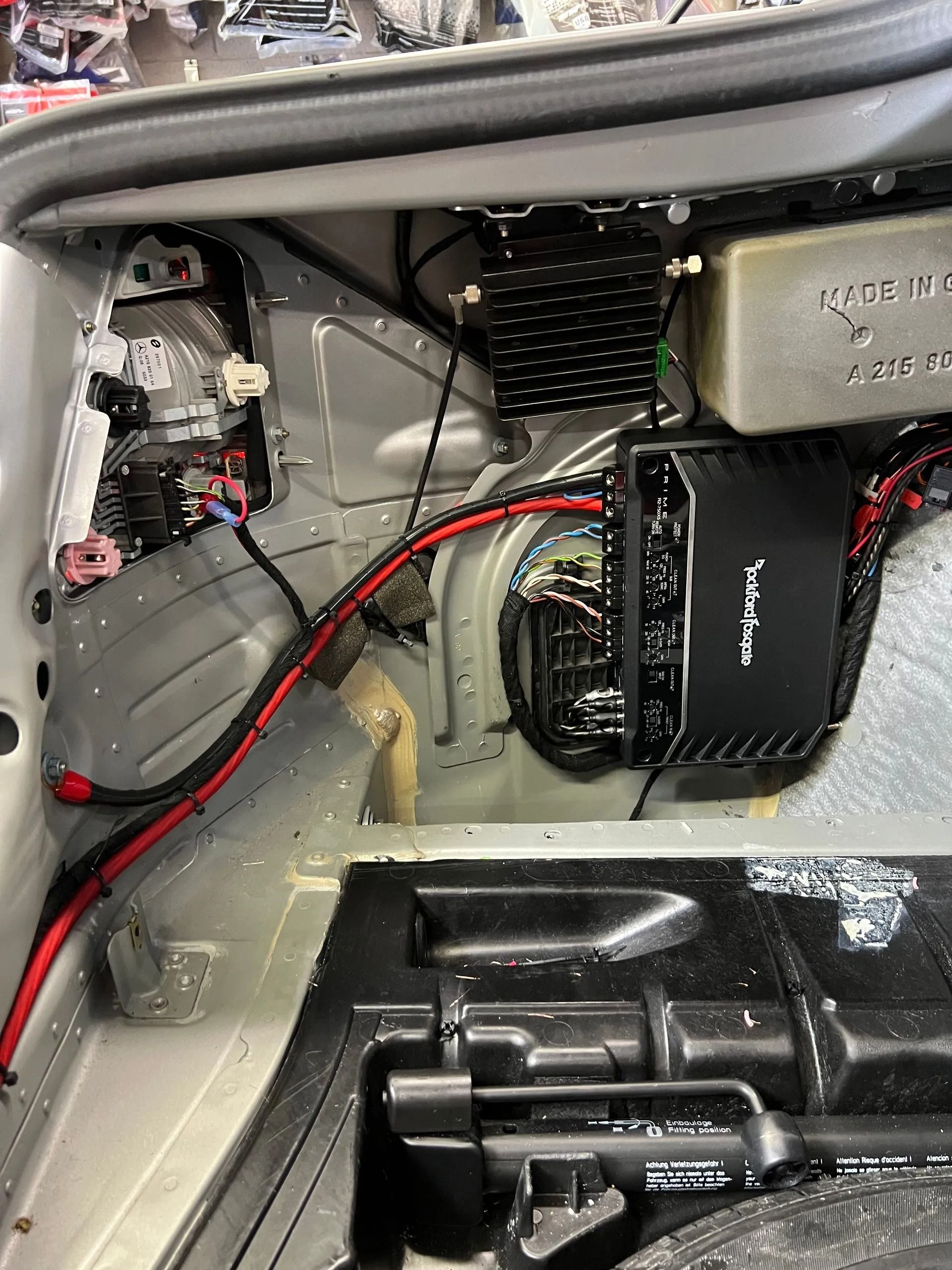 The inside of a slingshot with speakers and a subwoofer.