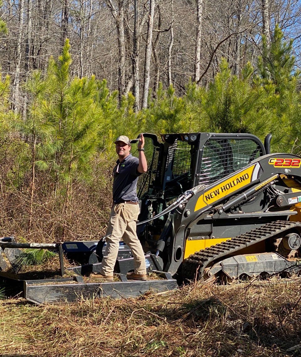 K & G Patton Enterprises Inc staff standing at a land clearing site