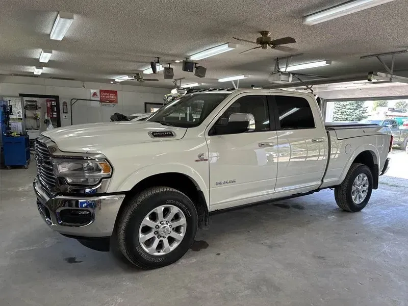 White Ram 2500 pickup truck parked inside a garage.