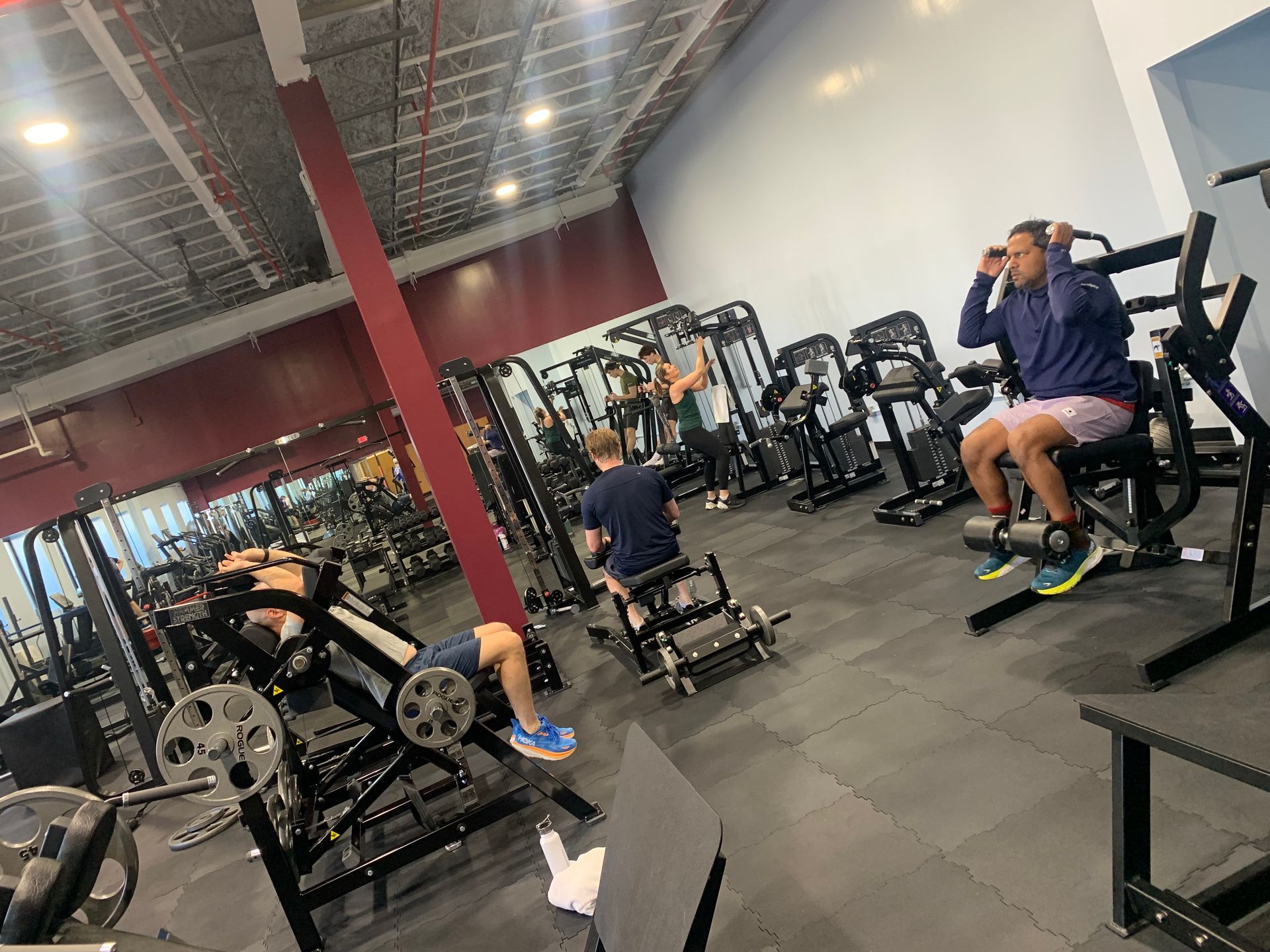A group of people are working out in a gym.