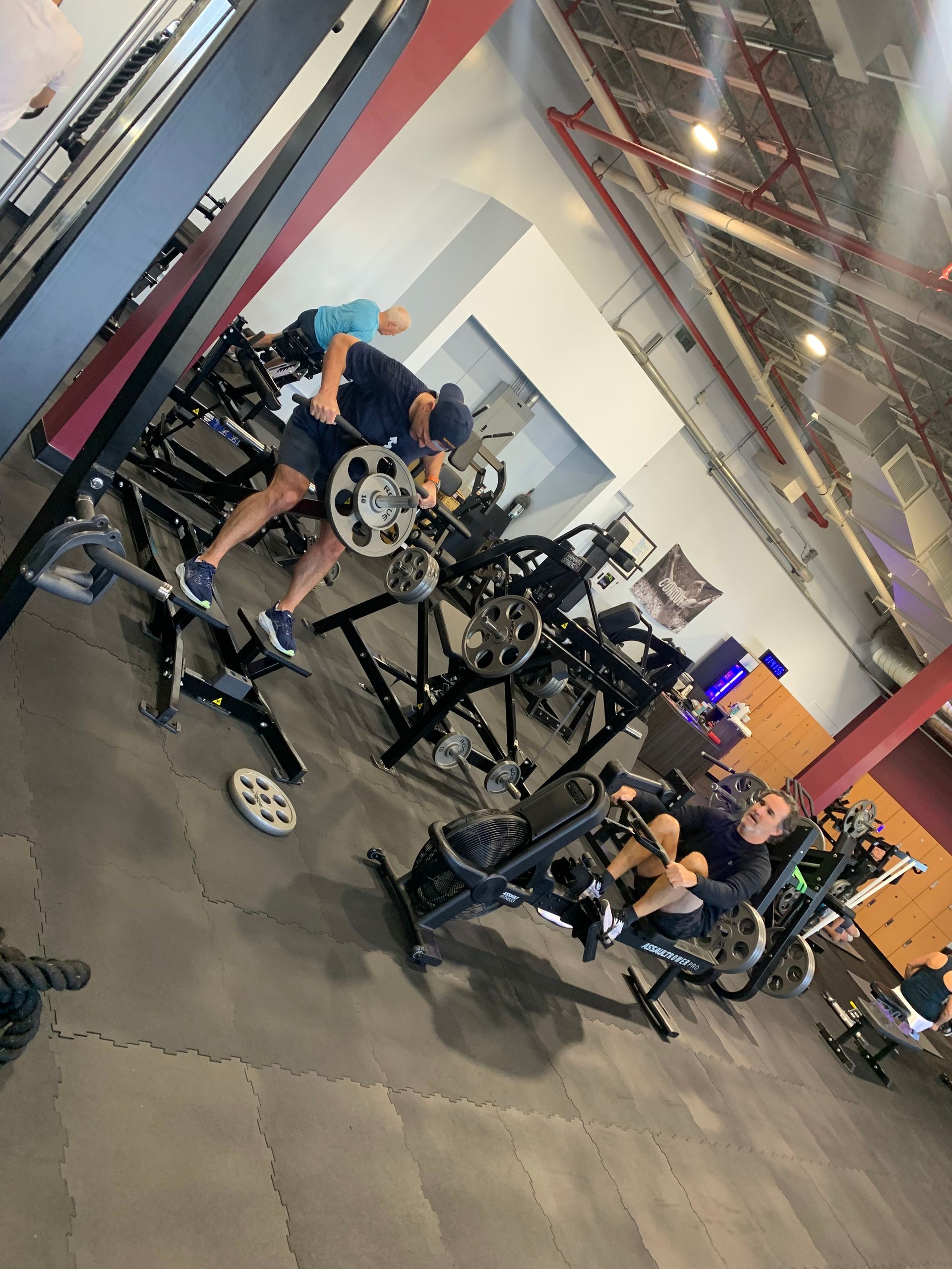 A group of people are working out in a gym.