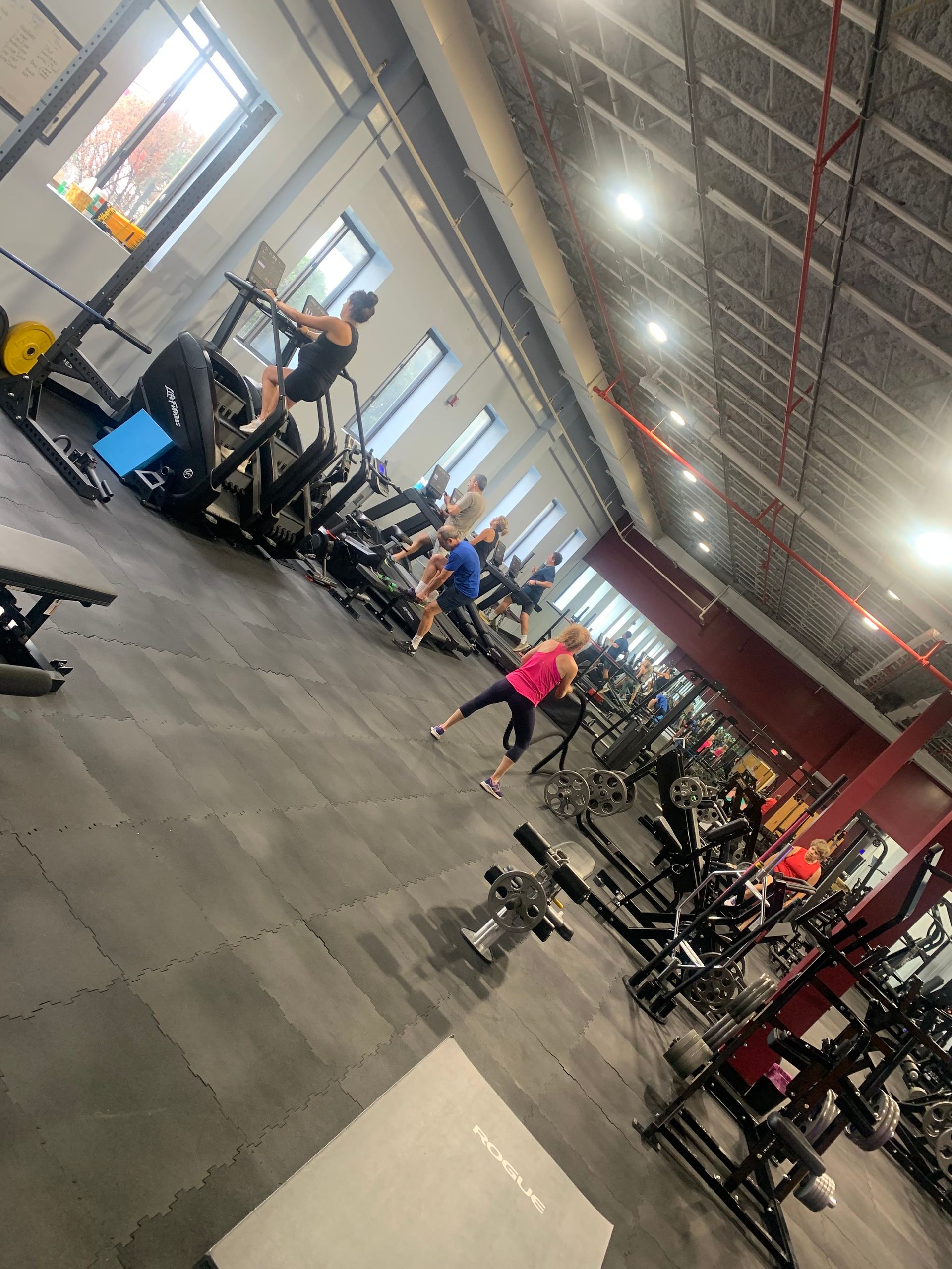 A group of people are working out in a gym.