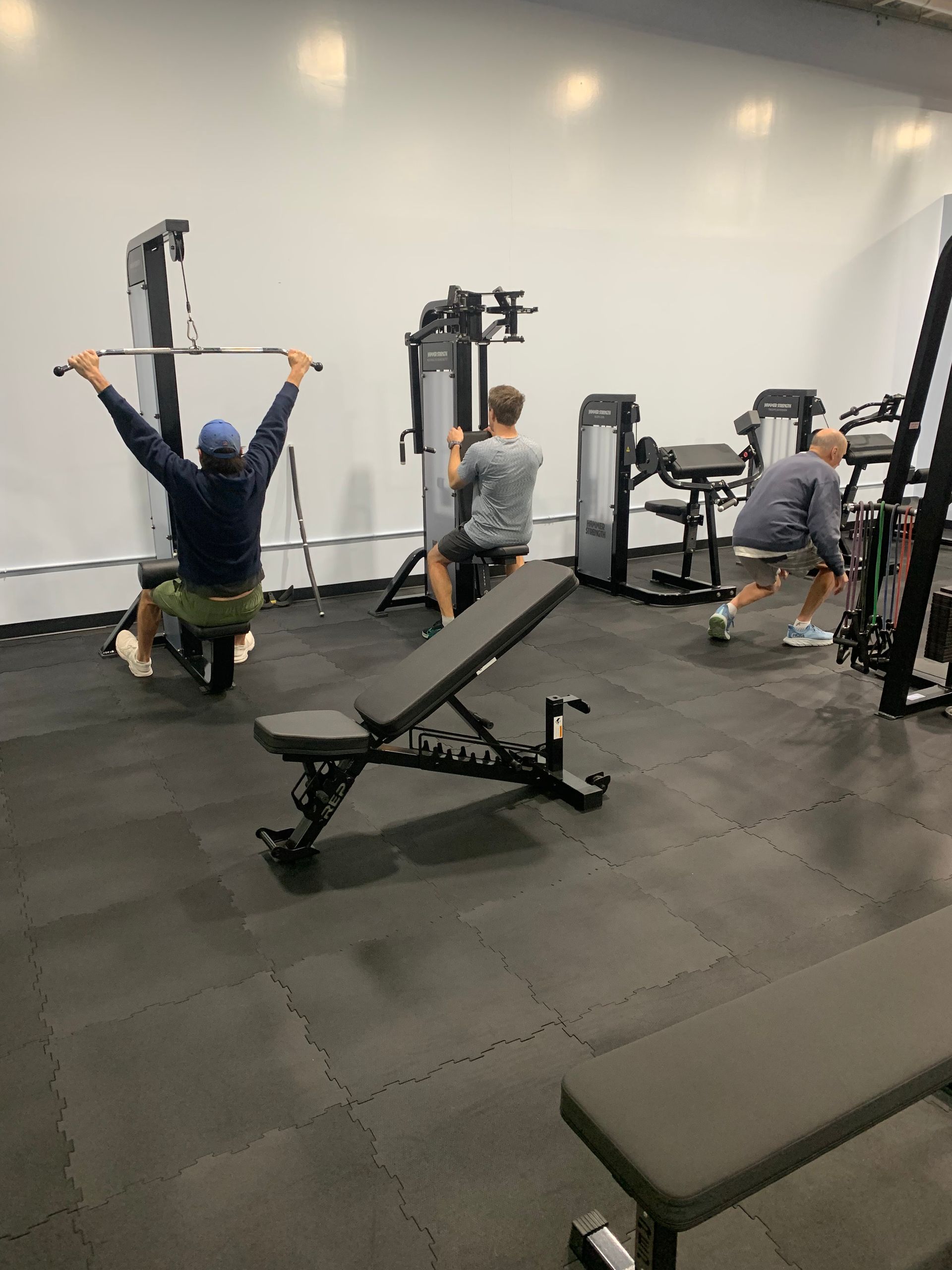 A group of people are working out in a gym.