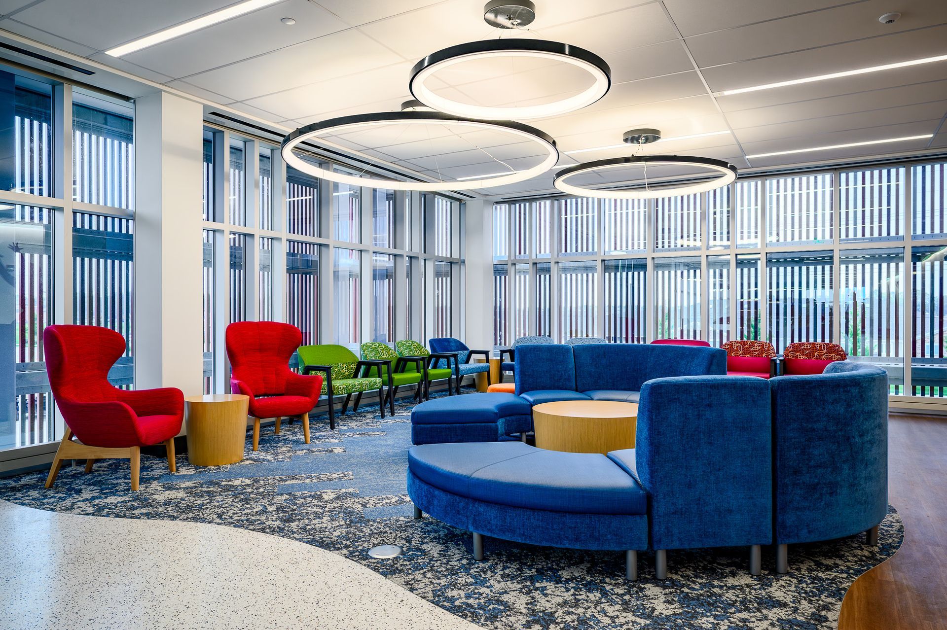 A wide and beautiful waiting area with couches 