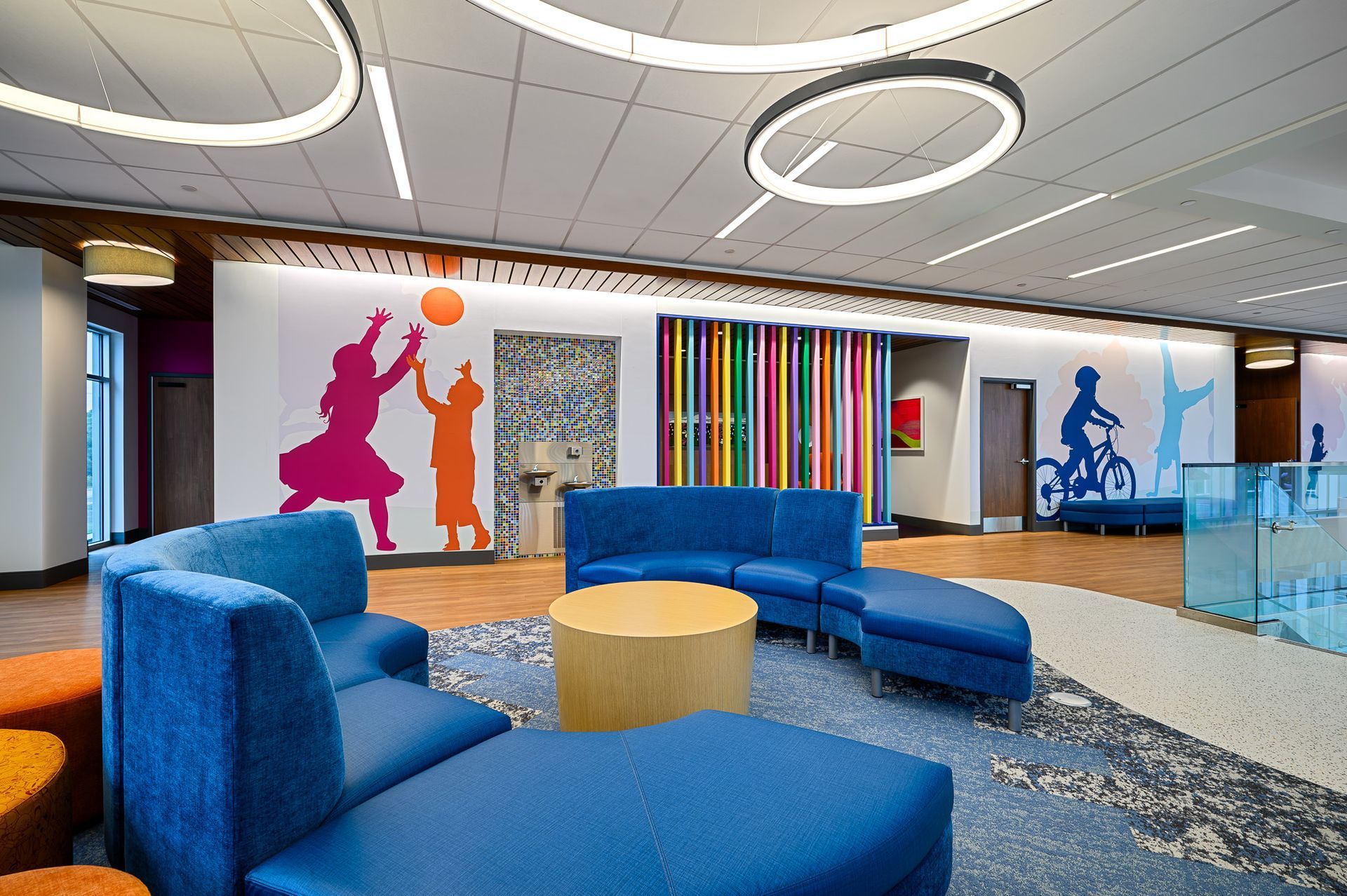 A wide room with blue couches