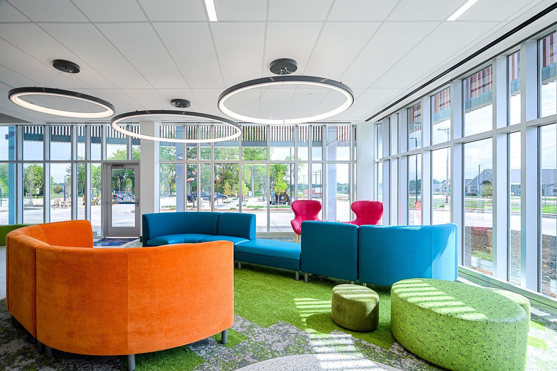 A big waiting room with colorful couches