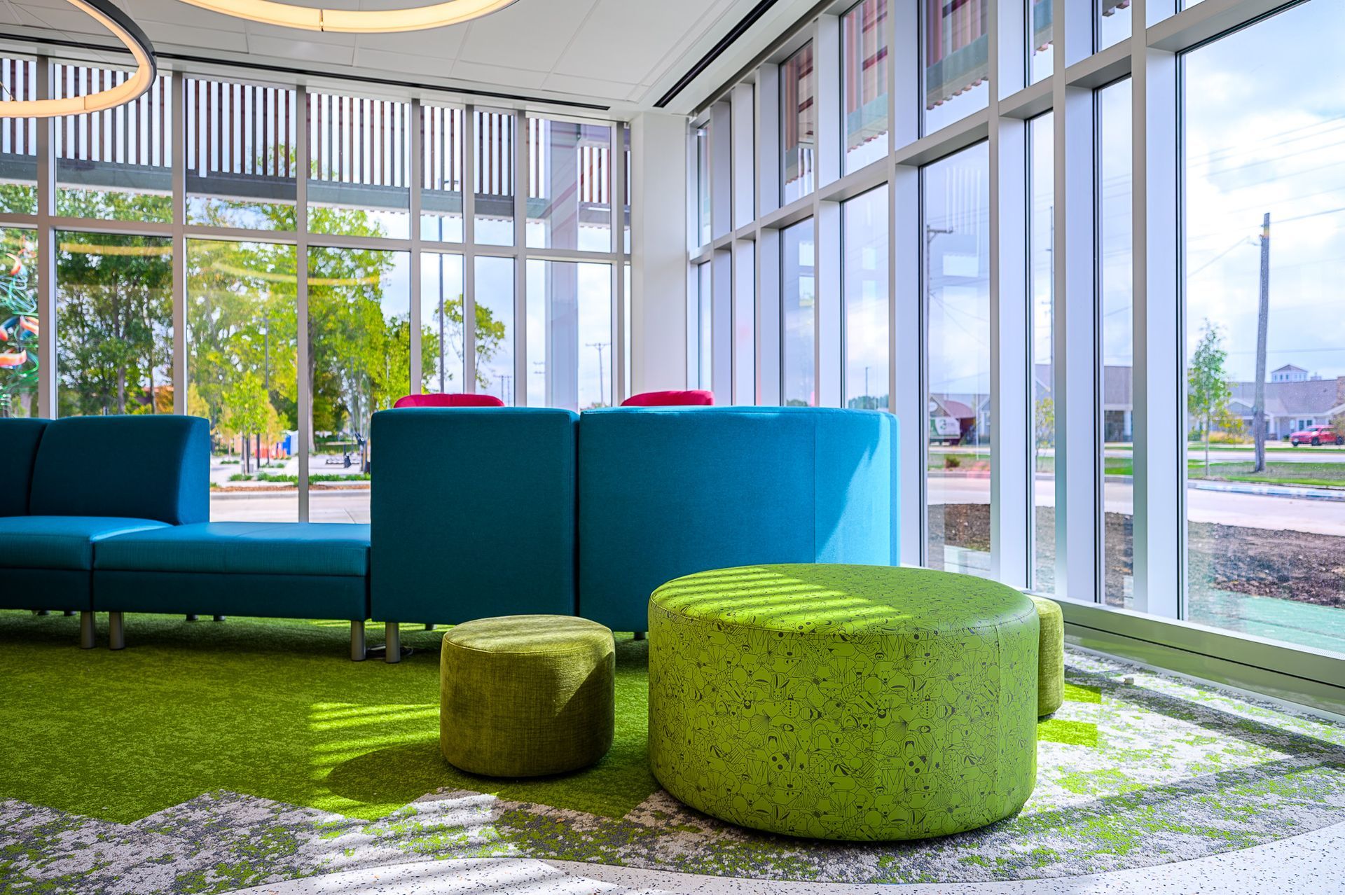 Comfortable couches in a room with glass windows