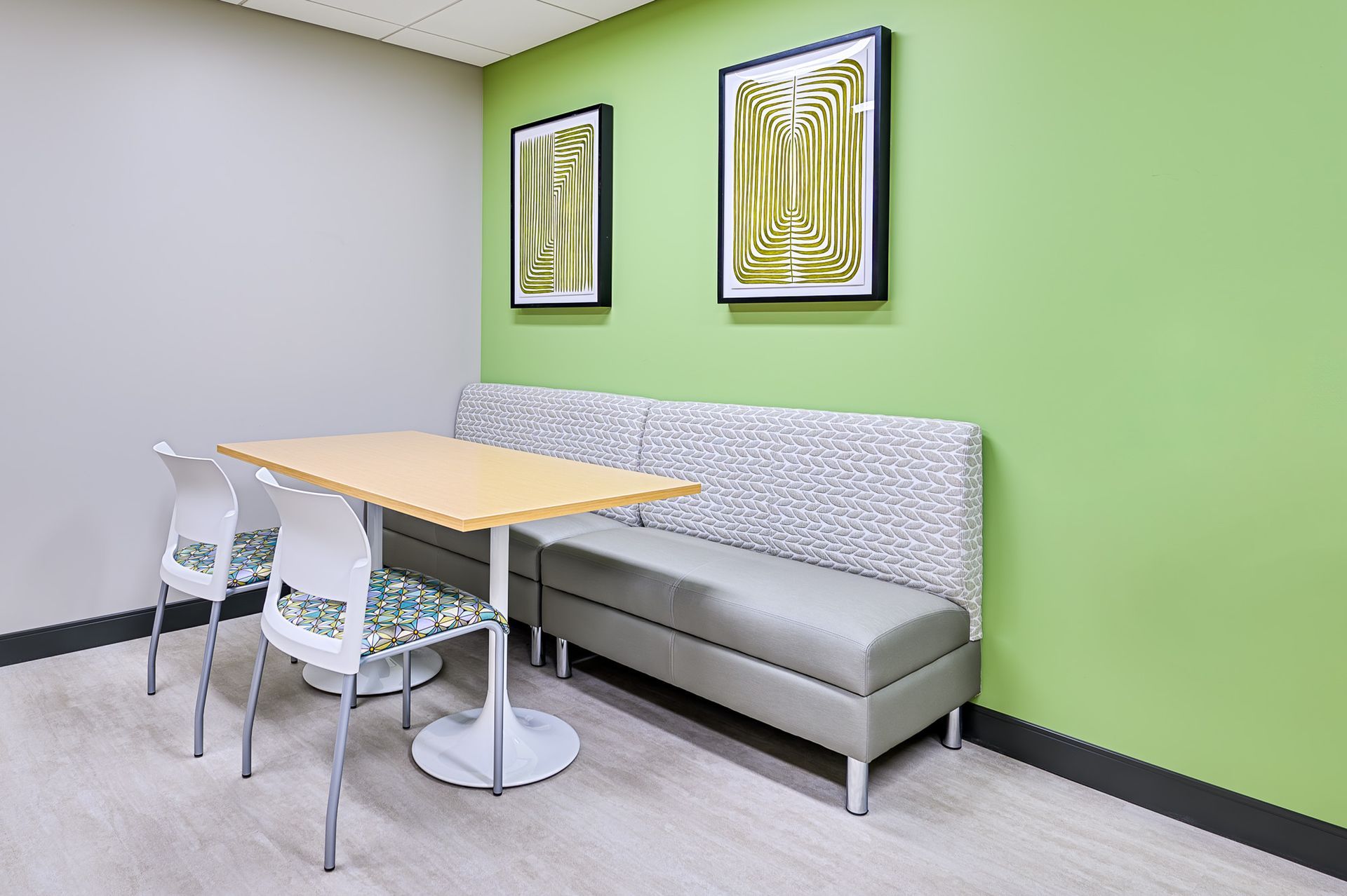 a lime green painted wall with a couch and table