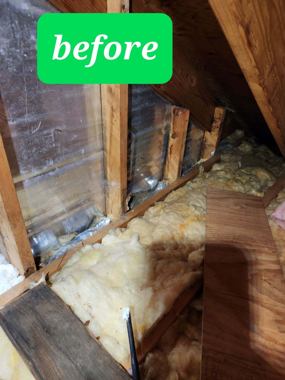 A picture of an attic before being insulated.