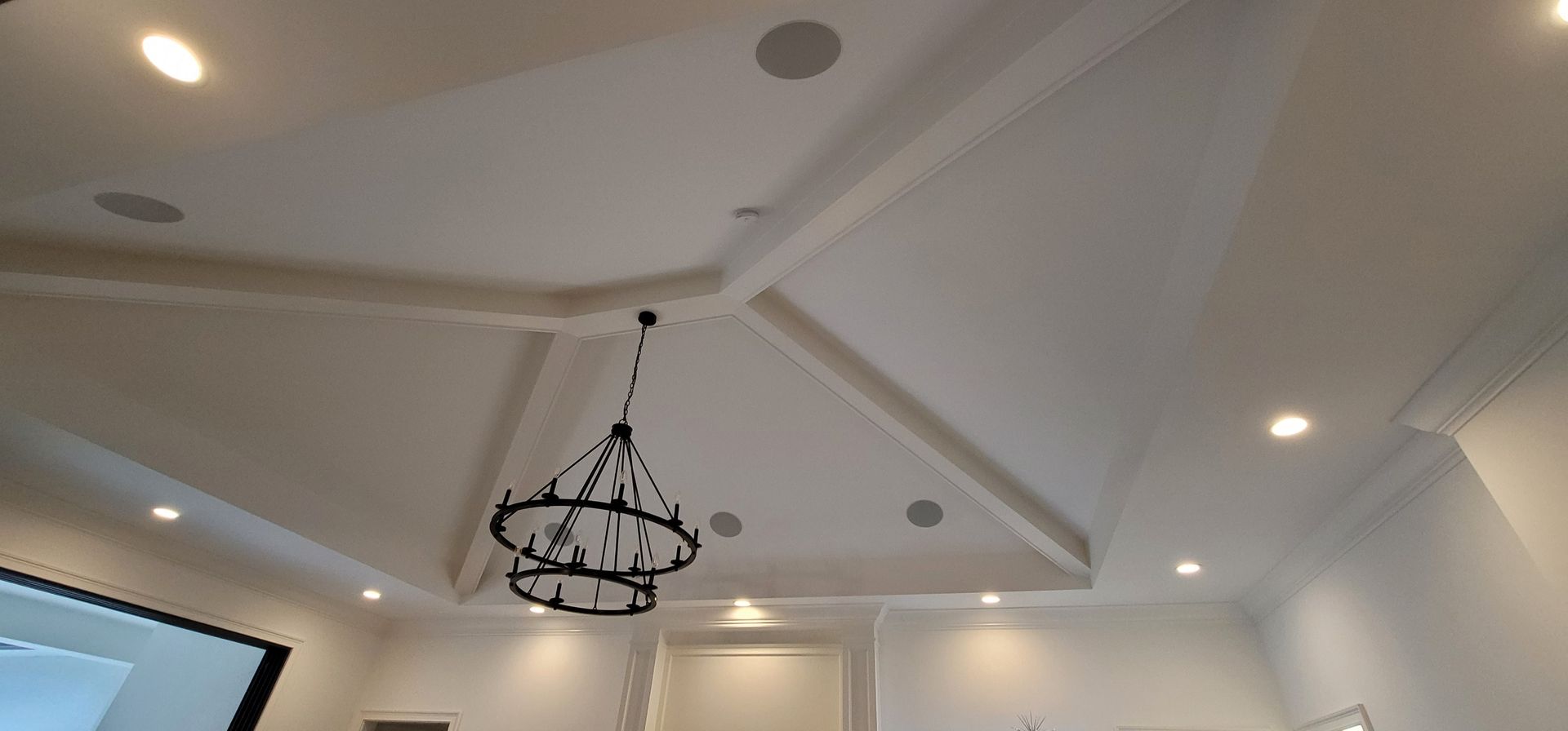 A chandelier is hanging from the ceiling of a room.