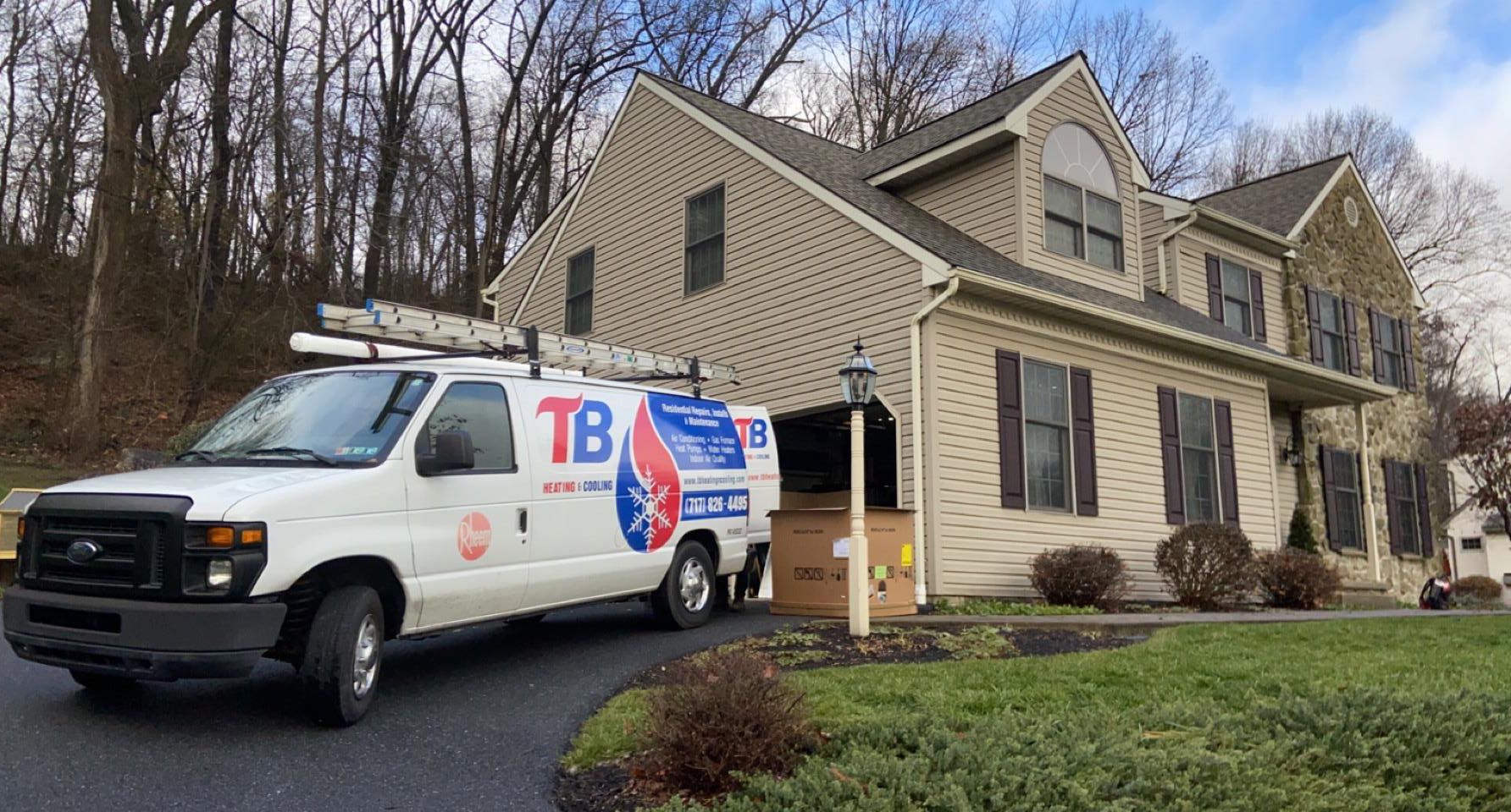 A white van is parked in front of a house.