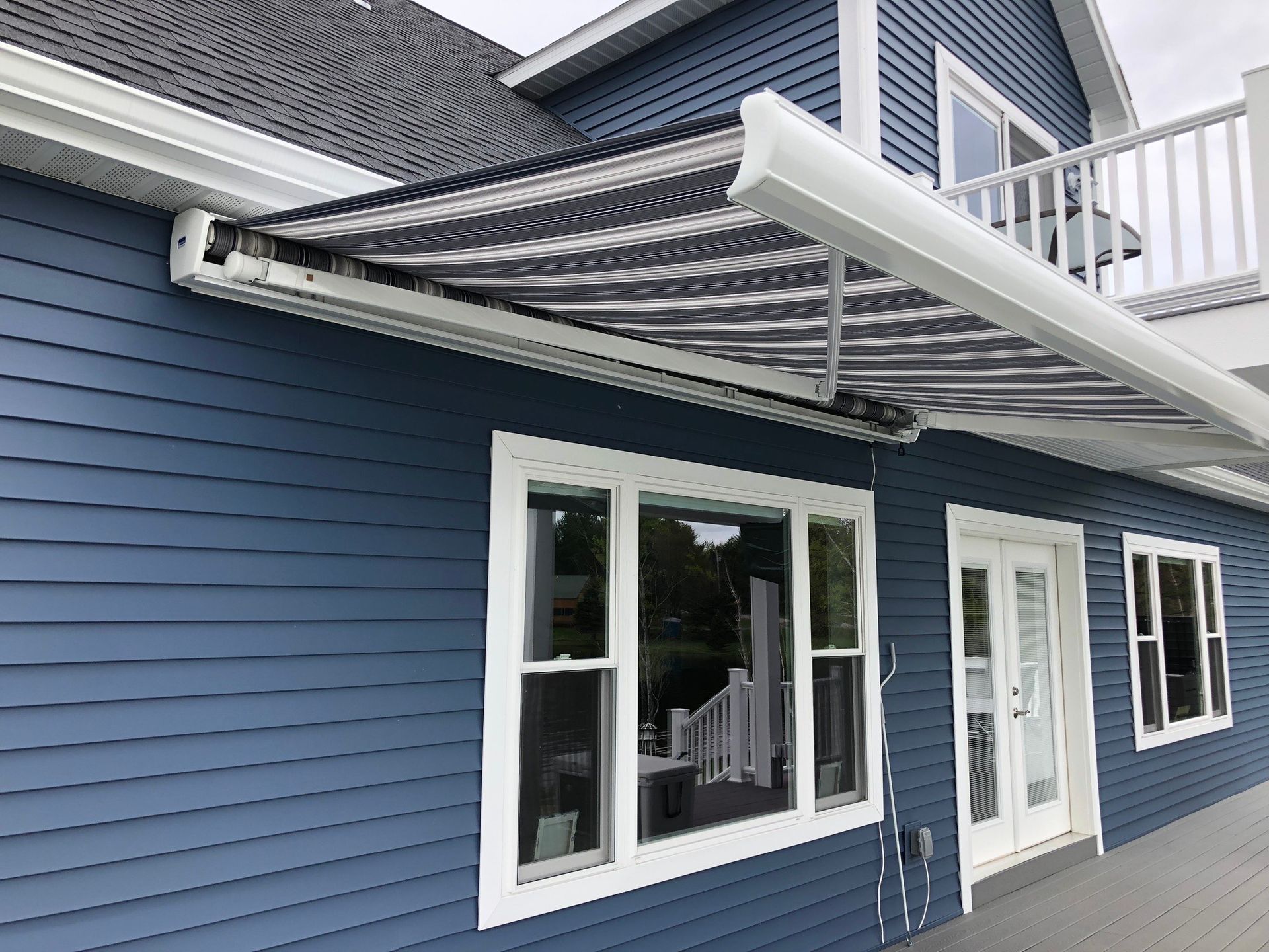 Image of rectangle awning attached to house.