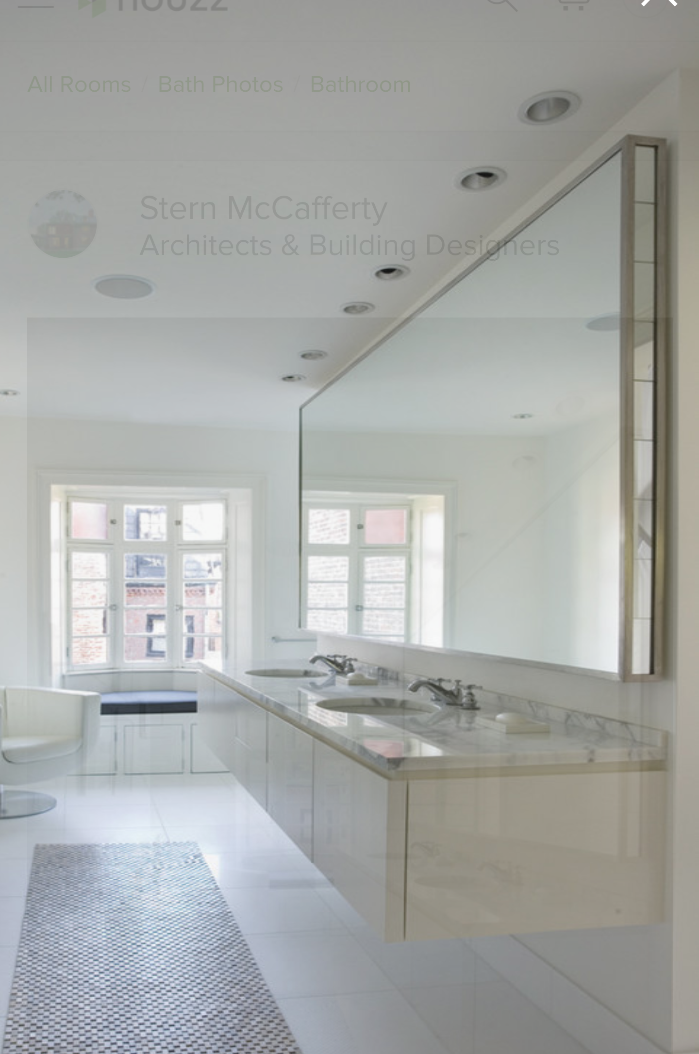 a bathroom with two sinks and a large mirror.